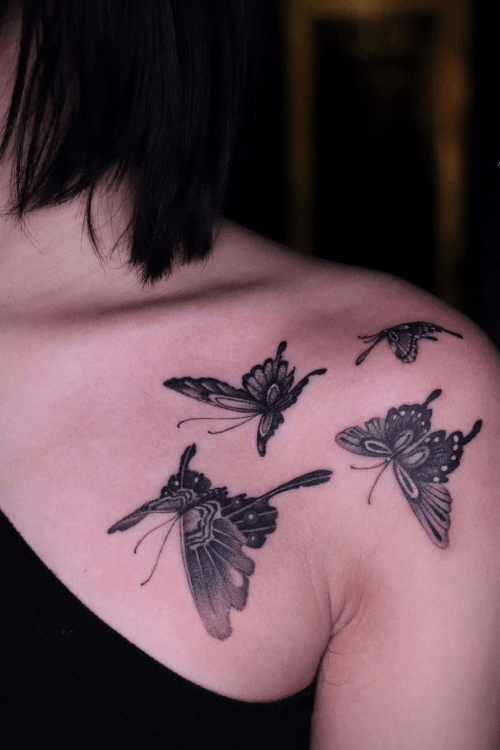 three black butterfly tattoos