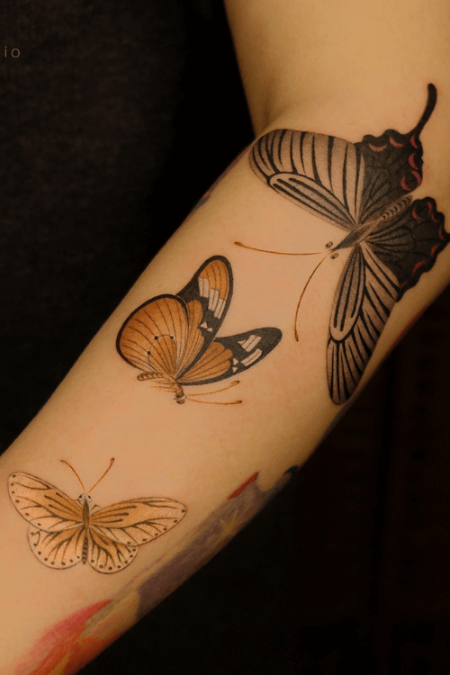 yellow butterfly tattoo